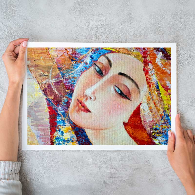 Woman hanging her printed abstract photography